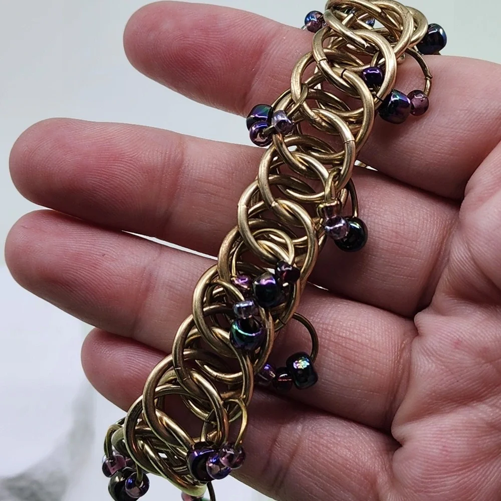 Kenneth Cole Gold Tone Woven Ring Bracelet Purple Bead Chunky Toggle Statement